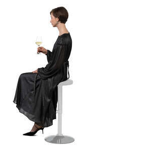 cut out woman sitting at a bar and drinking wine