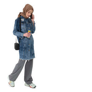 cut out muslim woman walking and talking on a phone