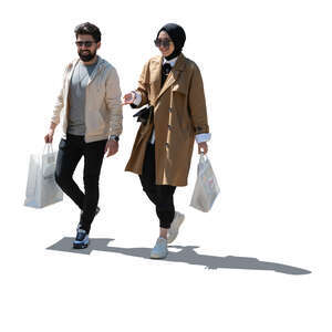 two cut out backlit young muslim people walking