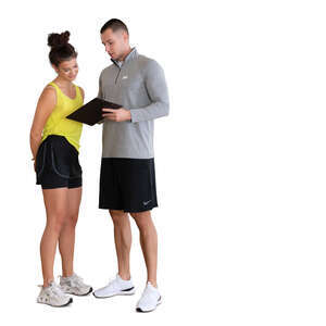 cut out woman in a gym talking to her personal trainer