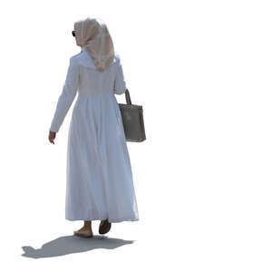 cut out backlit muslim woman walking