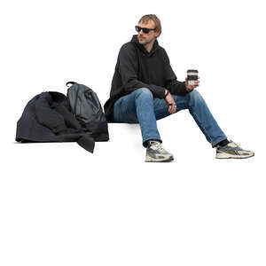 cut out man sitting on the stairs and drinking coffee