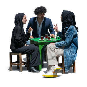 cut out group of three middle east people sitting in a cafe and drinking tea