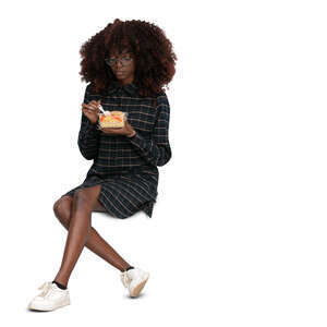 cut out woman sitting and eating salad