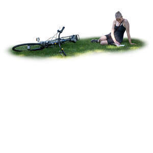 cut out woman sitting on the grass and reading a book