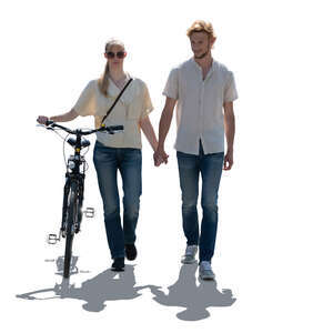 cut out backlit couple with a bike walking