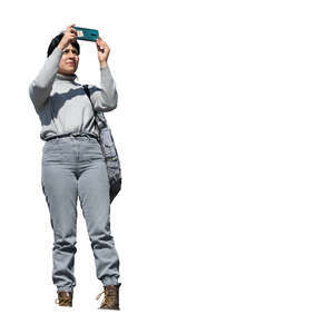cut out woman taking a picture seen from lower angel