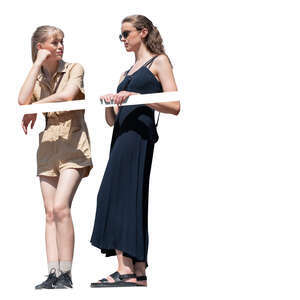 two cut out women standing on a balcony and talking