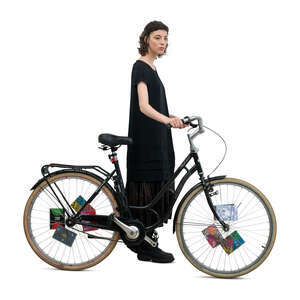 cut out woman in a black dress walking with a bike