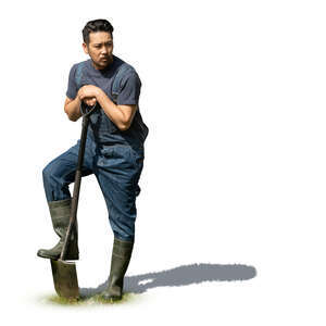 cut out asian man digging in the garden