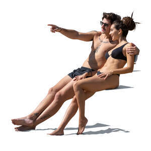 cut out couple at the beach sitting and looking at smth