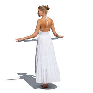cut out woman in a white summer dress standing on a balcony