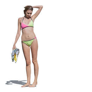 cut out woman in a bikini standing barefoot in the sun