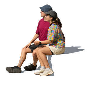 south american couple sitting and looking in one direction