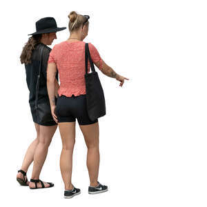 two young women standing and looking at smth