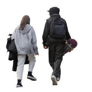 two teenagers with skateboard walking up the stairs