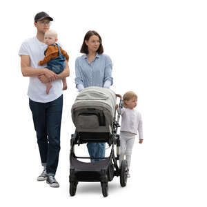 family with two little kids and a stroller walking