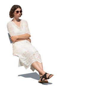 woman in a white dress sitting