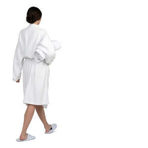 woman in a soft white bathrobe walking