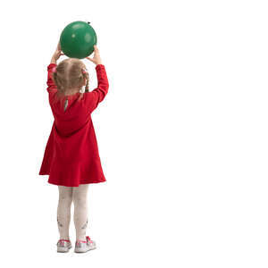 cut out little girl standing and playing with a balloon