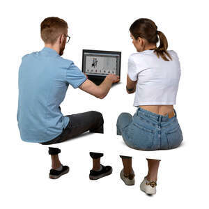 two cut out people sitting at a desk with computer and working