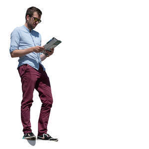 man standing on a higher floor and reading a magazine