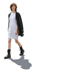 backlit woman in boots walking