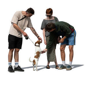 group of cut out people standing and playing with a dog
