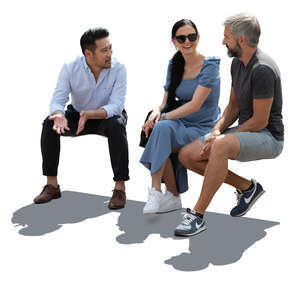 cut out backlit group of people sitting and talking