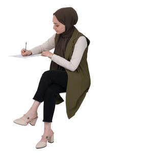 cut out muslim woman sitting at a desk and writing
