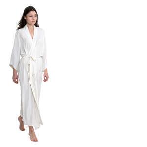 woman in a white silky bathrobe walking barefoot