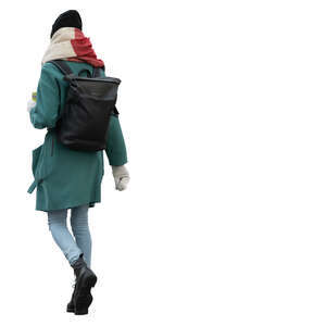 woman in a winter overcoat and hat walking
