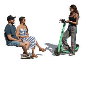 woman with a scooter standing and talking to two people sitting