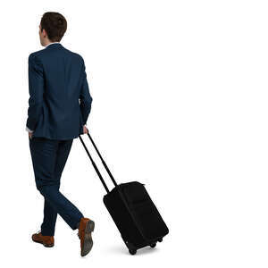 man in a suit and carrying a suitcase walking