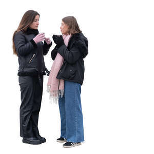 two cut out young women standing and drinking hot drinks