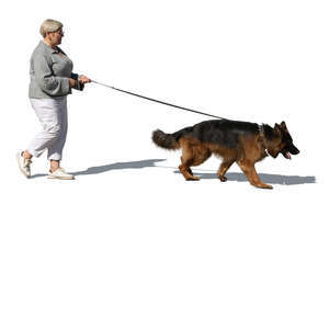 older woman walking a dog