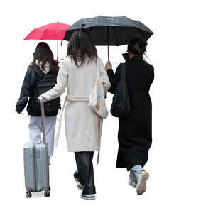group of women with suitcases and umbrellas walking