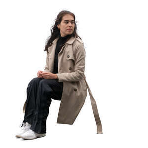 cut out mexican woman with an overcoat sitting