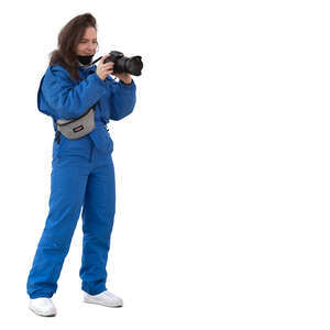 woman in winter taking a picture with a photo camera