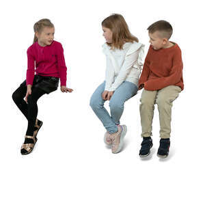 three children sitting and talking