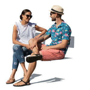 man and woman sitting outside in summer and talking