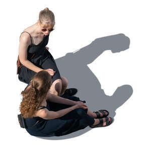 two women in black summer dresses sitting seen from above