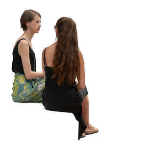 two women sitting and talking