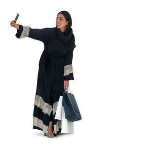 cut out arab woman standing and taking a selfie