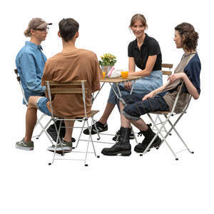 group of four young people sitting in a restaurant and talking