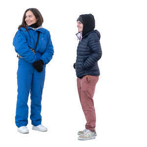 two women in late autumn standing and looking at smth