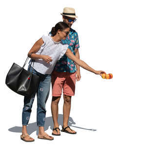man and woman buying apples at the market