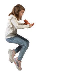 little girl sitting at a table and sculpting a dinosaur