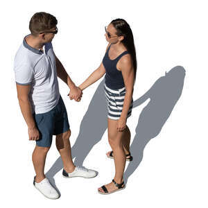 couple holding hands standing and looking at each other seen from above
