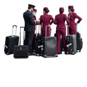 flight crew with a pilot and flight attendants with suitcases standing